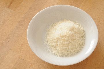 How to cook Italian lasagna, bowl of grated parmesan cheese