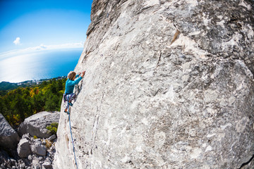 A rock climber on a wall.