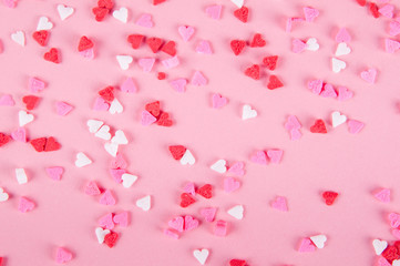 heart sprinkles on a pink background