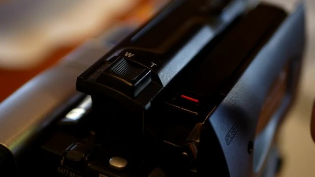 Inserting and ejecting a cassette into a camcorder