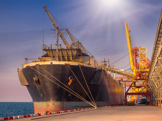 Bulk Vessel alongside at thailand port and loading bulk cargo by  shiploader.