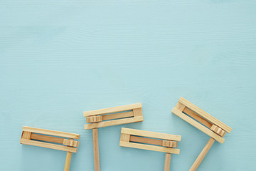 Purim celebration concept (jewish carnival holiday). Top view of noise maker traditional toy.