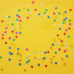 party background with colorful confetti. Top view.