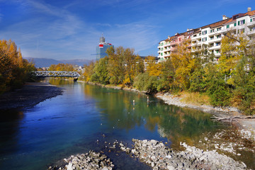 Fototapeta na wymiar Autumn colours surrounding the Arve River in Geneva, Switzerland, Europe