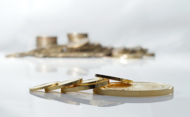Gold coins on a blurred background.