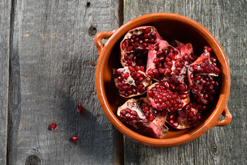 pottery pomegranate on wooden background