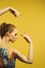 Young woman dancing in studio
