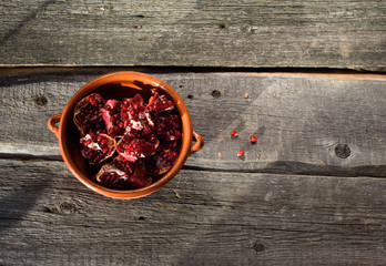 pottery pomegranate on wooden background