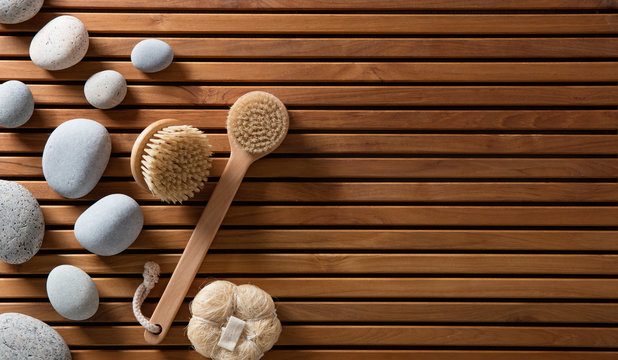 pebbles set on Turkish bath wooden board with body brushes
