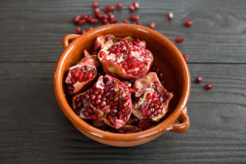 pottery pomegranate on wooden background
