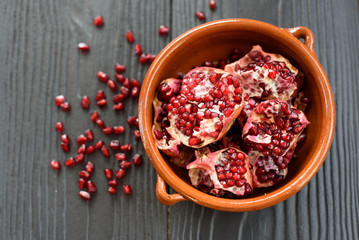 pottery pomegranate on wooden background