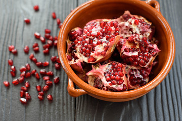 pottery pomegranate on wooden background