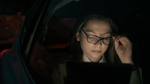 Woman Talking to the Driver and Putting Glasses On
