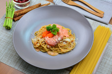 Salmon spaghetti. pasta salmon on the table.