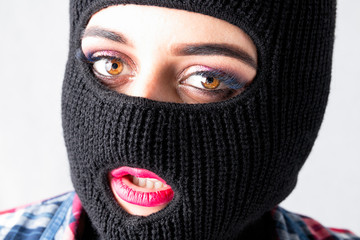 sexy bandit girl, fat model in balaclava, Woman Plus Size in shirt posing topless on white background with brown eyes. XXL female in black mask with lips tongue