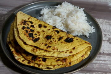 Chickepea flour flat bread or besan ki roti with rice.