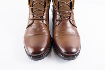 Male brown leather boot on white background, isolated product, comfortable footwear.