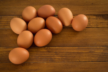 Fresh eggs on wooden table