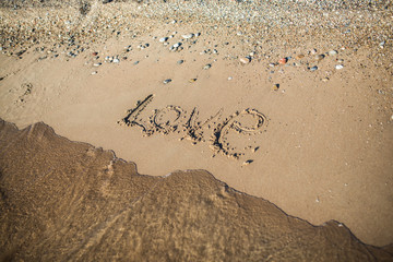 The inscription on the sand love