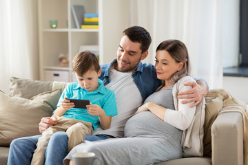 happy family with smartphone at home