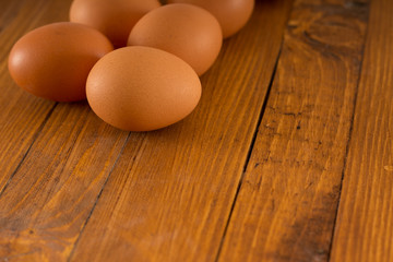 Fresh eggs on wooden table