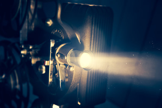 Film projector with dramatic lighting, high contrast image