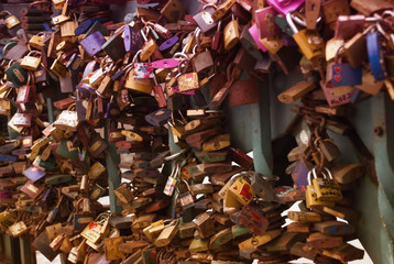 Heart and lock as a symbol of love on the bridge of love. Feast of love and relationships, Valentine's Day.