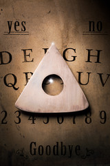 Talking board and planchette used on seances for communicating with the dead, high contrast image © fergregory
