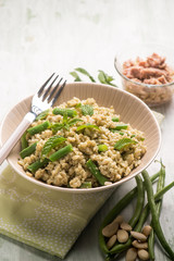 cold rice salad with tuna greenbeans almond and mint, selective focus