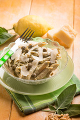 pasta with pesto sauce and parmesan flake, selective focus