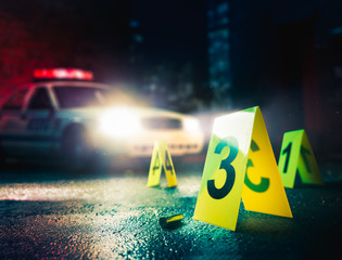police car at a crime scene with evidence markers, high contrast image - 188721525