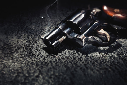 Smoking gun on the floor, high contrast image