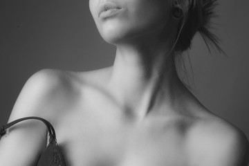 Shoulders and neck of a beautiful woman. Black and white - obrazy, fototapety, plakaty