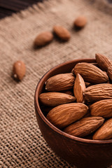 almond essential oil on a wooden background