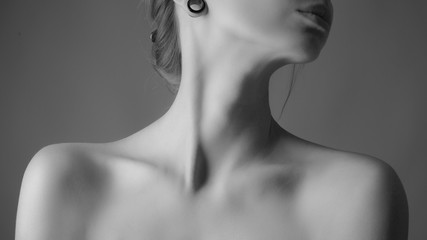 Shoulders and neck of a beautiful woman. Black and white