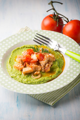 fish stew with peas cream, selective focus