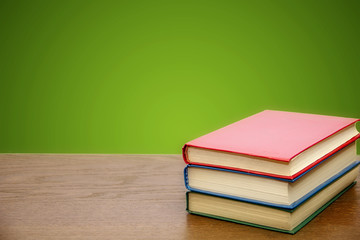 School books on the background of a school board