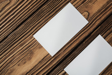 Blank business cards on a wooden surface
