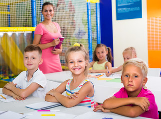 cheerful kids at school lesson .