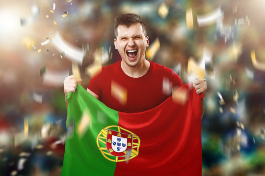 A Portuguese fan, a fan of a man holding the national flag of Portugal in his hands. Soccer fan in the stadium. Mixed media