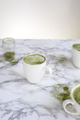 Green Matcha Latte on Marble Table