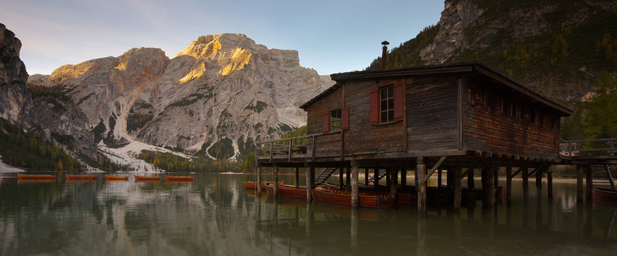 Woody house on the bank of the lake Lago di Braies, Dolomites, Italy