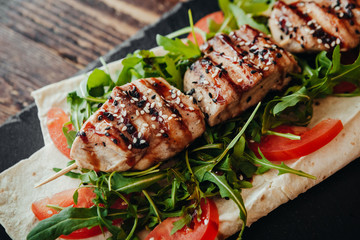 appetizing and delicious grilled meat dish with vegetables and herbs