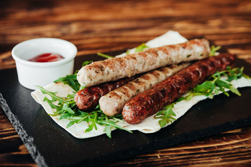 appetizing and delicious grilled meat dish with vegetables and herbs