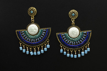 earrings in Boho style with mint and blue beads isolated on white