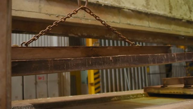 hot dip galvanizing. Industrial worker against the background of a bath with liquid zinc