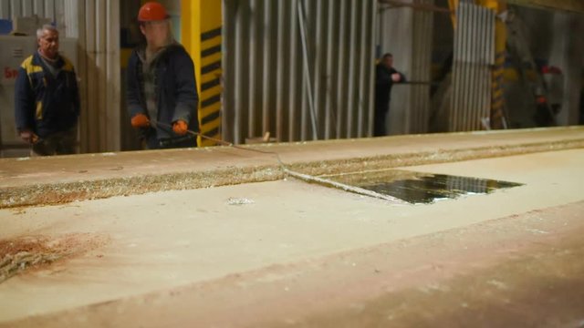 hot dip galvanizing. Industrial worker against the background of a bath with liquid zinc