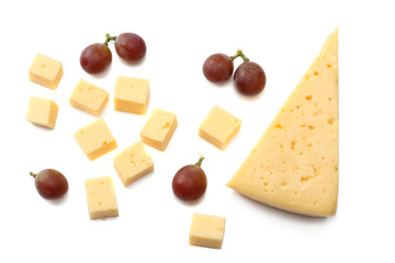 piece of cheese with grapes isolated on white background