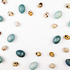 Stylish Frame background with quail and blue easter eggs with copy space for text. isolated on...
