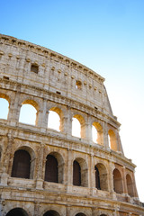 Fototapeta premium Colosseum Rome. Ruins of the ancient Roman amphitheatre. Travel to Italy, Europe. Crowd and queue. Sunny day and blue sky
